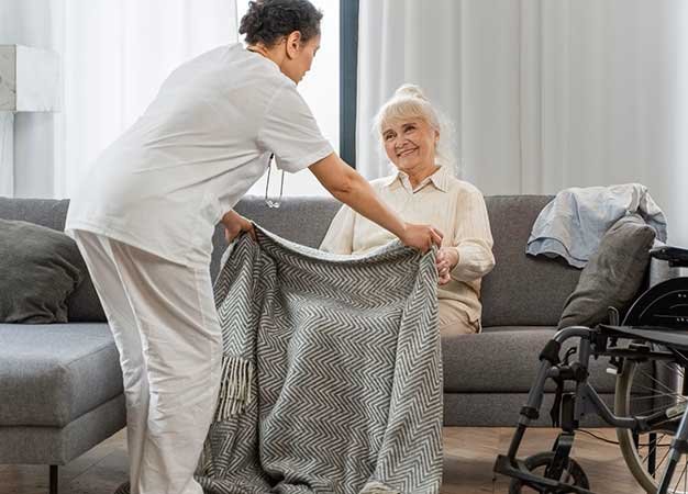 A care worker helping a client at home